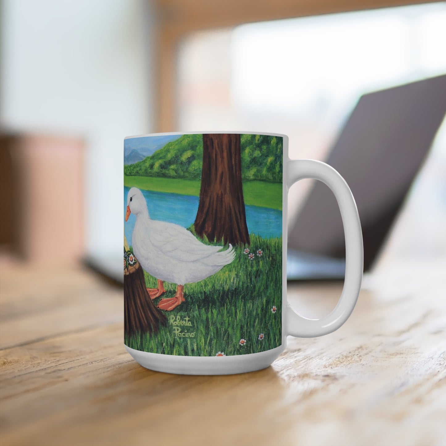 15 oz white ceramic mug featuring Sunlit Supper by Roberta Pacino with two white ducks and three ducklings gathered around a tree stump near the water