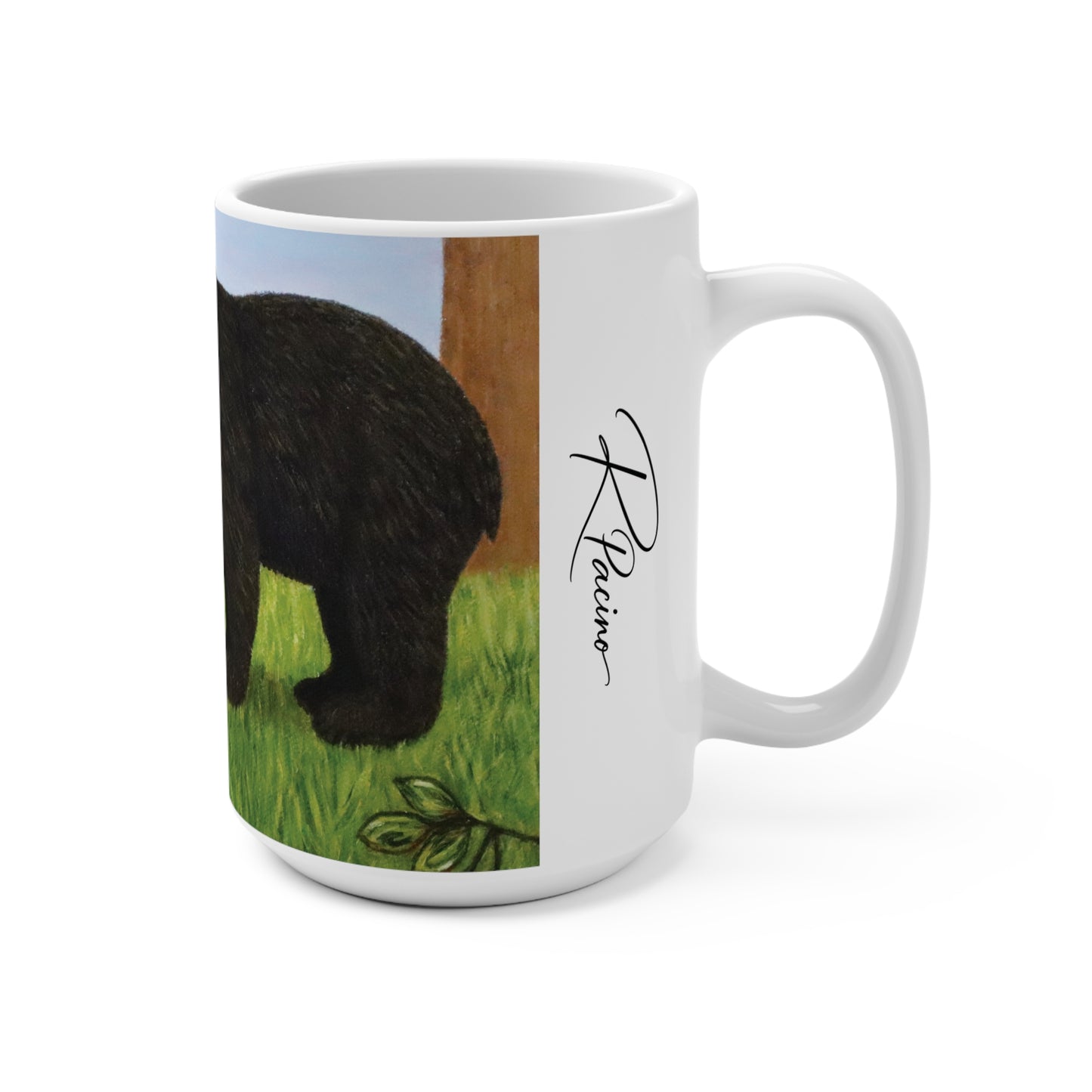 A white ceramic mug featuring a printed illustration of a black bear on the side, alongside a black signature that reads 'R. Pacino'.