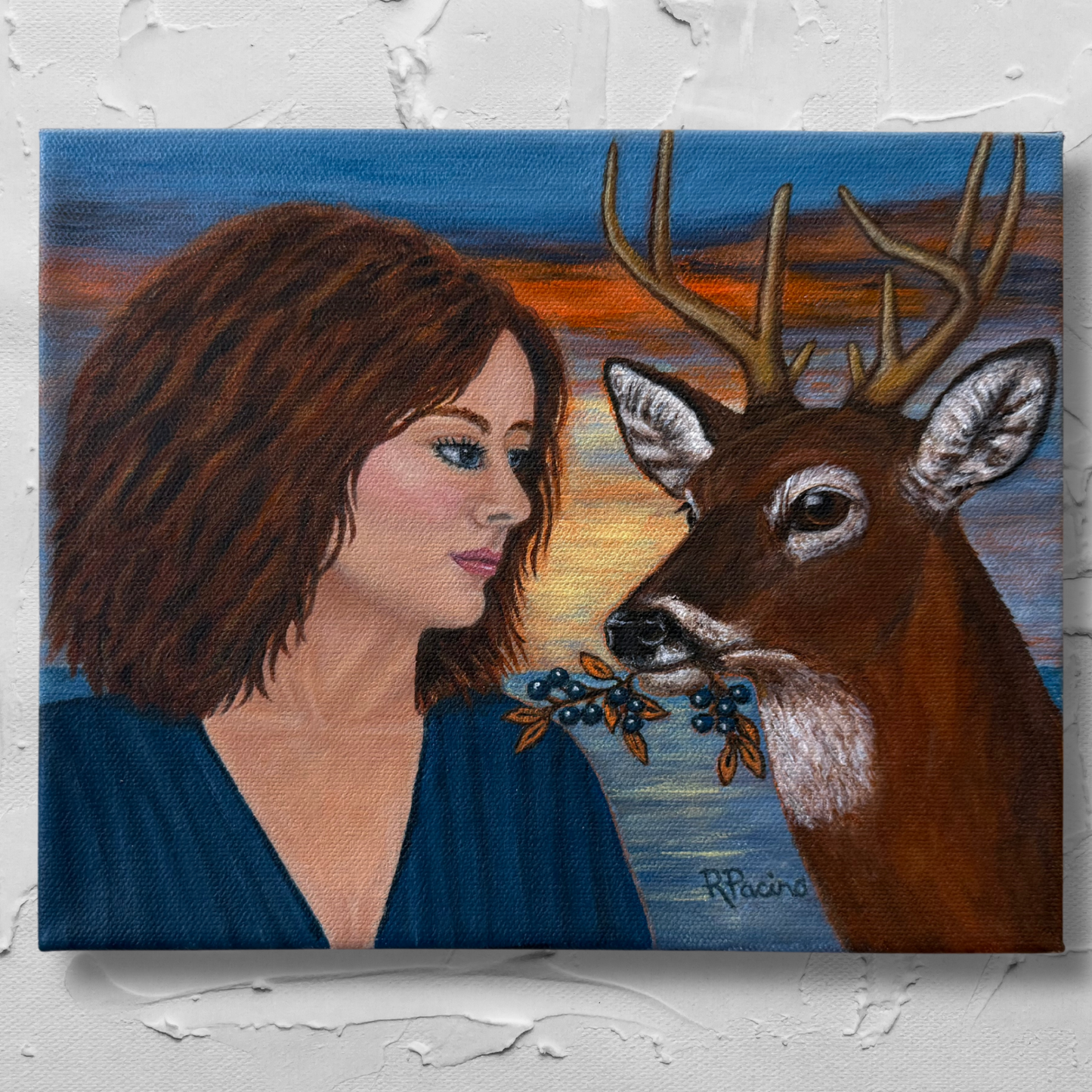 Buck’s Return original acrylic painting of a woman and symbolic buck offering a berry-laden branch at sunset by Roberta Pacino.