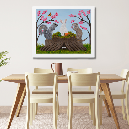 Garden Gathering museum print displayed above a light wood dining table in a bright neutral dining room