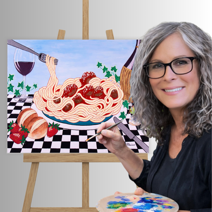 Roberta Pacino holds a paintbrush beside Sicilian Comfort, a colorful canvas painting of spaghetti with meatballs on an easel. The painting includes a glass of red wine, strawberries, bread, and a checkered tablecloth.