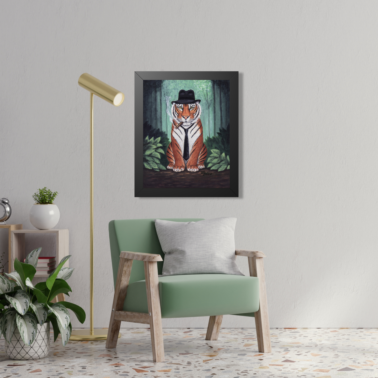 Framed artwork of a tiger wearing a fedora in a forest by Roberta Pacino, above a green armchair in a room.