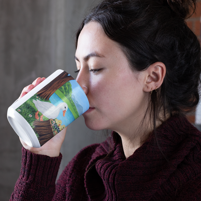 Woman drinking from a mug with a duck design, by Roberta Pacino.